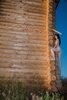 Nude Girl Climbing on the Logs Hut
